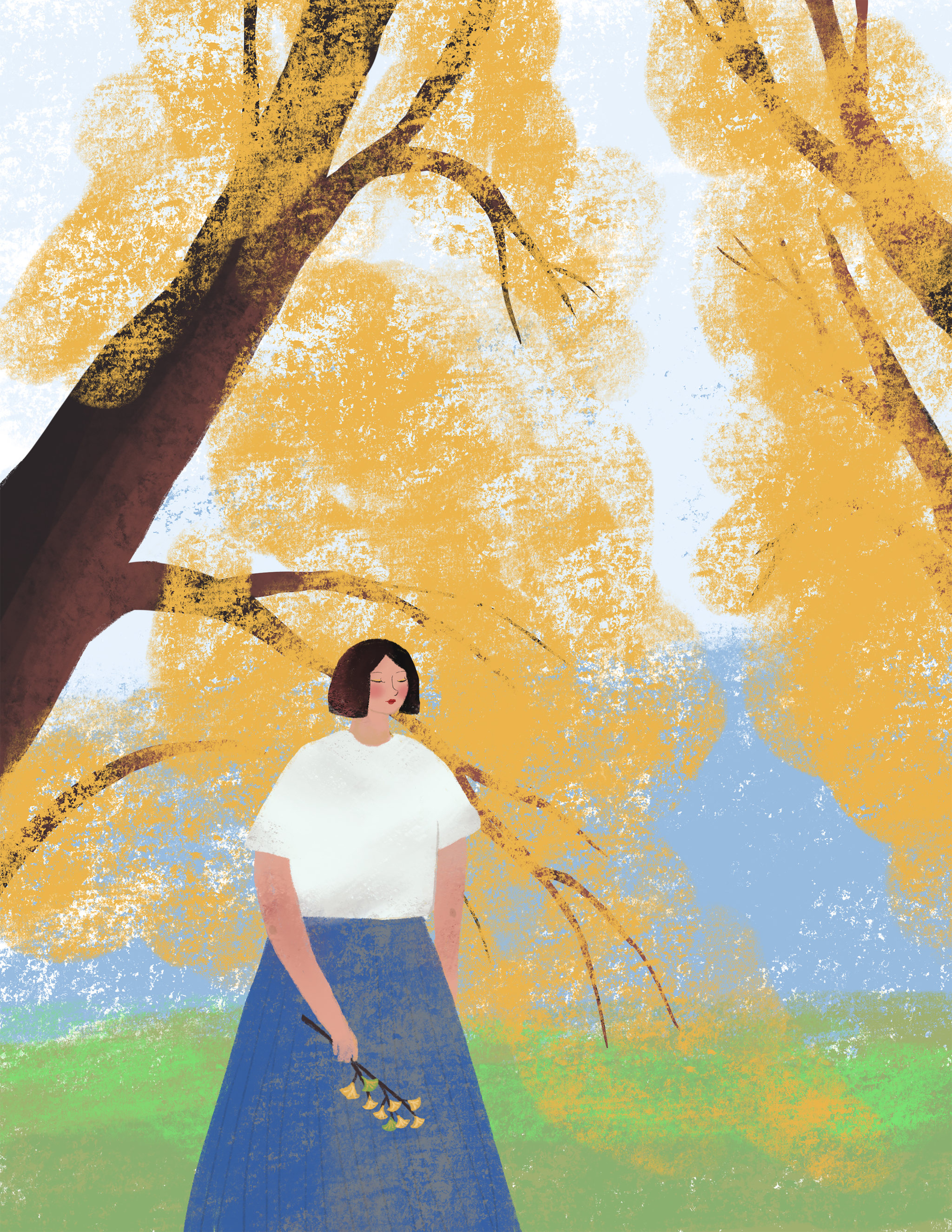 秋天银杏树下的女人